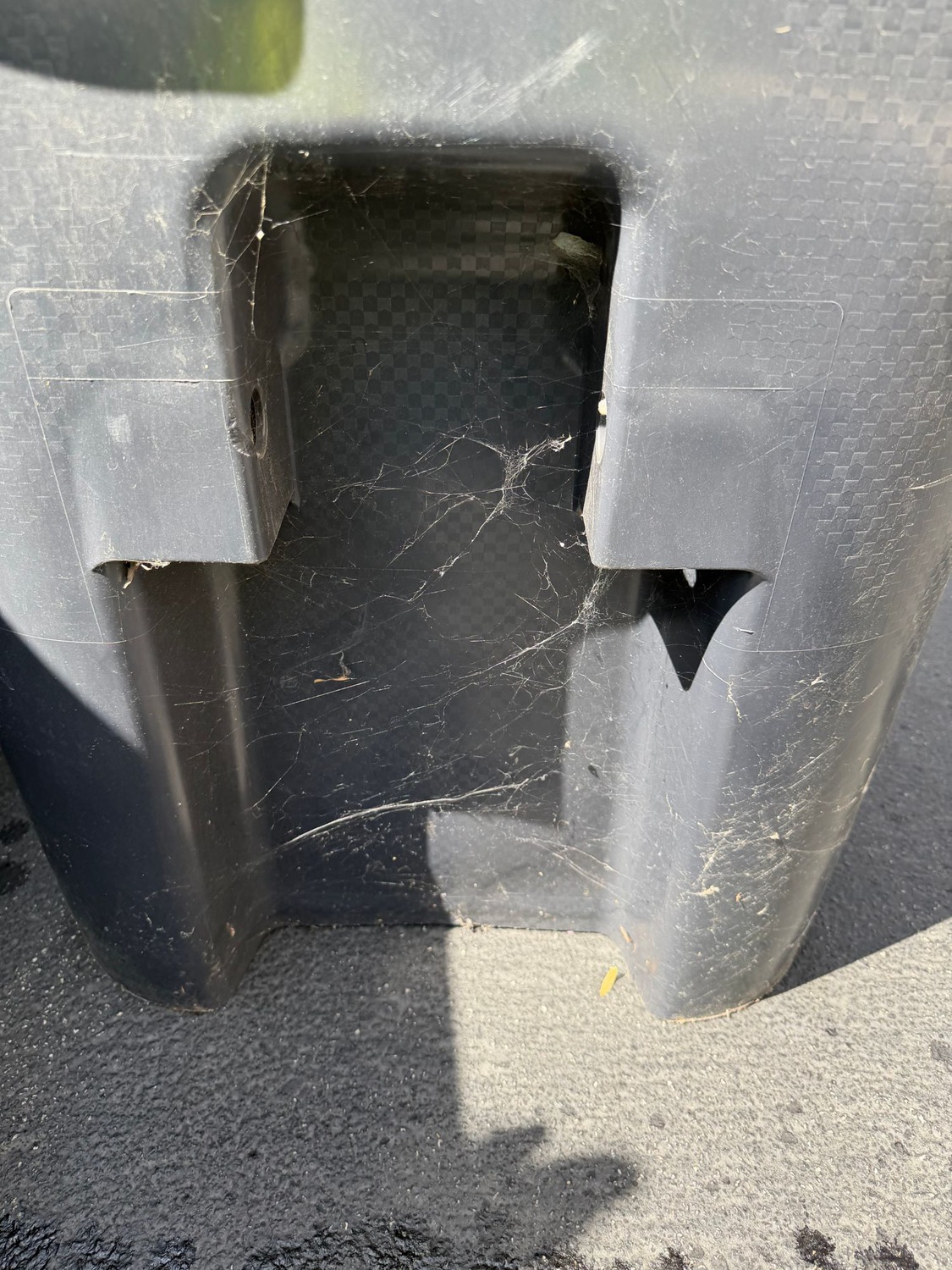Before: dusty, cobwebbed trash bin corner