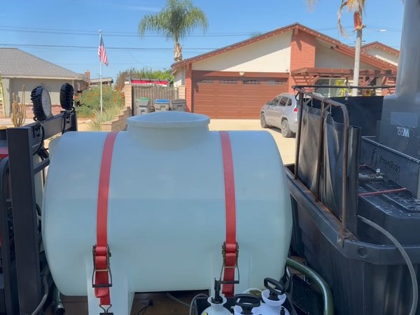 Dumpster Diver cleaning rig set up in a driveway